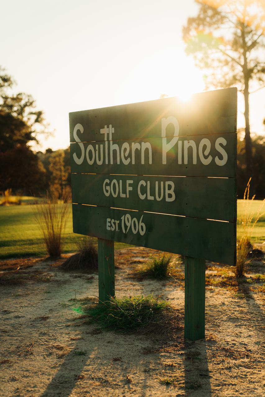 The Southern Pines Golf Club sign at golden hour
